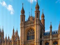 Headline image with Parliament building under blue sky